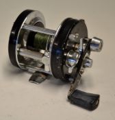 Abu Ambassadeur 5001C multiplier reel, black end plates, left hand wind, foot stamp 86-09-02.