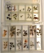 Flies: 4x large clear plastic boxes containing several hundred unused trout dry flies and nymphs