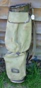 Period leather and canvas oval golf bag, c/w travel hood, ball pocket, and the original leather