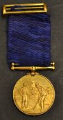 Fine gilt golfing medal and ribbon c.1900 - the obverse finely embossed with golfing figure, his