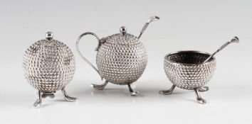 Early silver plated golf ball cruet set - 3x bramble golf ball pattern condiments each mounted on 3x