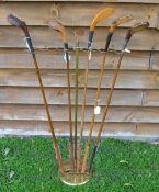 Interesting brass golf club display stand - adjustable splayed arched top to hold 11 clubs mounted
