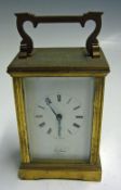 'St James London' Carriage Clock made in England brass, white with black roman numerals, with slight