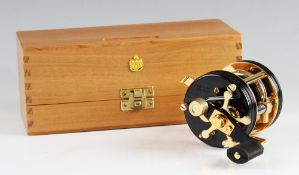 Rare Ambassadeur 5000CDL 24ct gold plated multiplier reel: black ribbed end plates, foot stamp