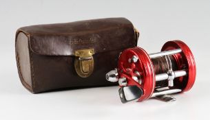 Abu Ambassadeur 6000 multiplier reel: red finish with 3 screw smooth end plate, foot stamped 057002,