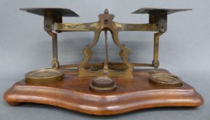 A set of T J Smith & Son, London postal scales with weights and letter rates to pan,