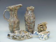 Five pieces of studio pottery by Barry Wade of organic textured forms, vases and jugs,