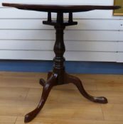 A 19thC mahogany tripod table with bird cage mechanism,