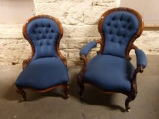 A Victorian mahogany spoon back armchair with button back and serpentine front raised on carved