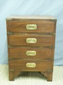 A campaign style bedside chest of four drawers,