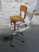 A retro child's shaped plywood chair and a modern chrome swivel/office armchair