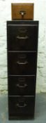 A vintage oak four drawer filing cabinet and a further small single drawer,