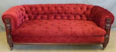 A Victorian mahogany Chesterfield sofa with carved and reeded frame,