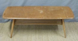 A light elm Ercol coffee table with stick style undershelf,