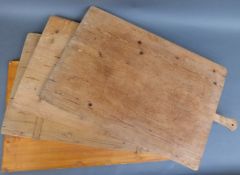 Four large wooden pizza or cheese boards,