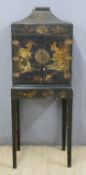 A 19thC Japanese lacquered cabinet on stand with lift up pagoda top,