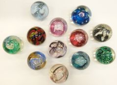 Twelve Caithness glass paperweights mostly named, including Extravaganza, Space Traveller, Sorcerer,