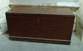 A late 19thC stained pine trunk with candle box,