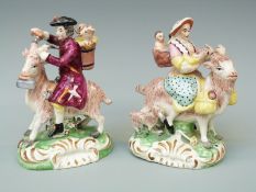 A pair of 19thC Staffordshire figures riding goats,