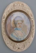 A 19thC portrait miniature on ivory, head and shoulders bust of a lady in fine attire,