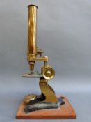 A cased late 19thC / early 20thC brass microscope
