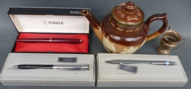 A Doulton teapot with silver rim,