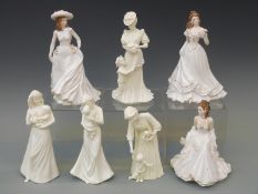 Seven Royal Worcester figurines including three from the Golden Moments Series and the First Kiss,