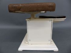 A set of c1930 bathroom scales with enamelled circular dial,
