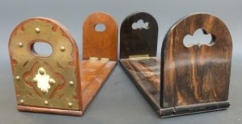 An antique mahogany extending book slide with decorative brass ends,