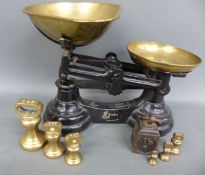 A set of kitchen scales with 1lb downwards bell weights