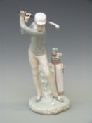 A Lladro figure of a golfer,