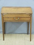 A 19thC oak bureau/desk with fall flap,