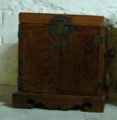 A small elm Chinese cabinet,