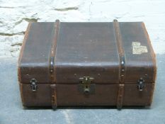 A vintage ash bound trunk with leather handles,