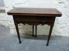 A 19thC mahogany fold over card table with single drawer raised on tapering legs with stepped feet,
