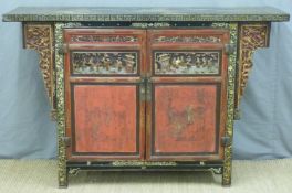 A 19th/early 20thC Chinese altar cabinet with carved and lacquered decoration ,