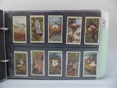 A collection of cigarette cards in three albums, includes Wills & Players,