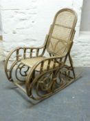 A bentwood rocking chair with rattan seat and a hatstand,