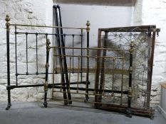 A cast iron and brass double bed,