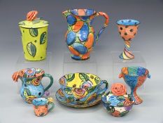 A collection of Mary Rose Young ceramics, including jugs, oversized teacup and saucer etc,