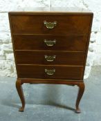 An early 20thC mahogany four-drawer music cabinet,