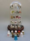 A collection of thimbles on a stand including Spode,