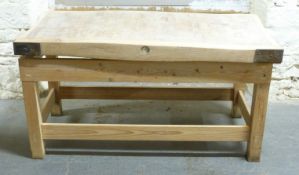 A metal bound butcher's block on stand,