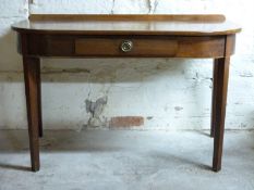 A mahogany hall table with single drawer raised on square tapering legs,