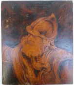 A 19thC pokerwork panel of a continental bearded man in helmet,