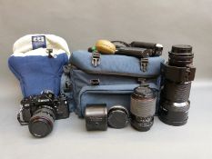 A Canon A-1 SLR camera, Tokina 28-70mm,