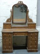 A 19thC satinwood twin pedestal breakfront dressing table with swing frame mirror