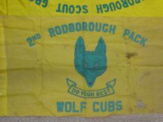 A collection of Rodborough Scout group flags, staffs,