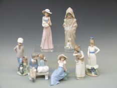 Seven Nao figures of children with animals or birds and sweethearts,