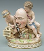 A Meissen figural group of two putti, allegorical of comedy,